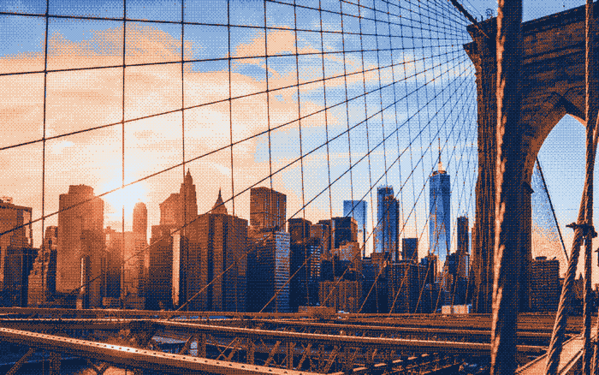The Manhattan skyline seen through Brooklyn Bridge cables in blue and peach light
