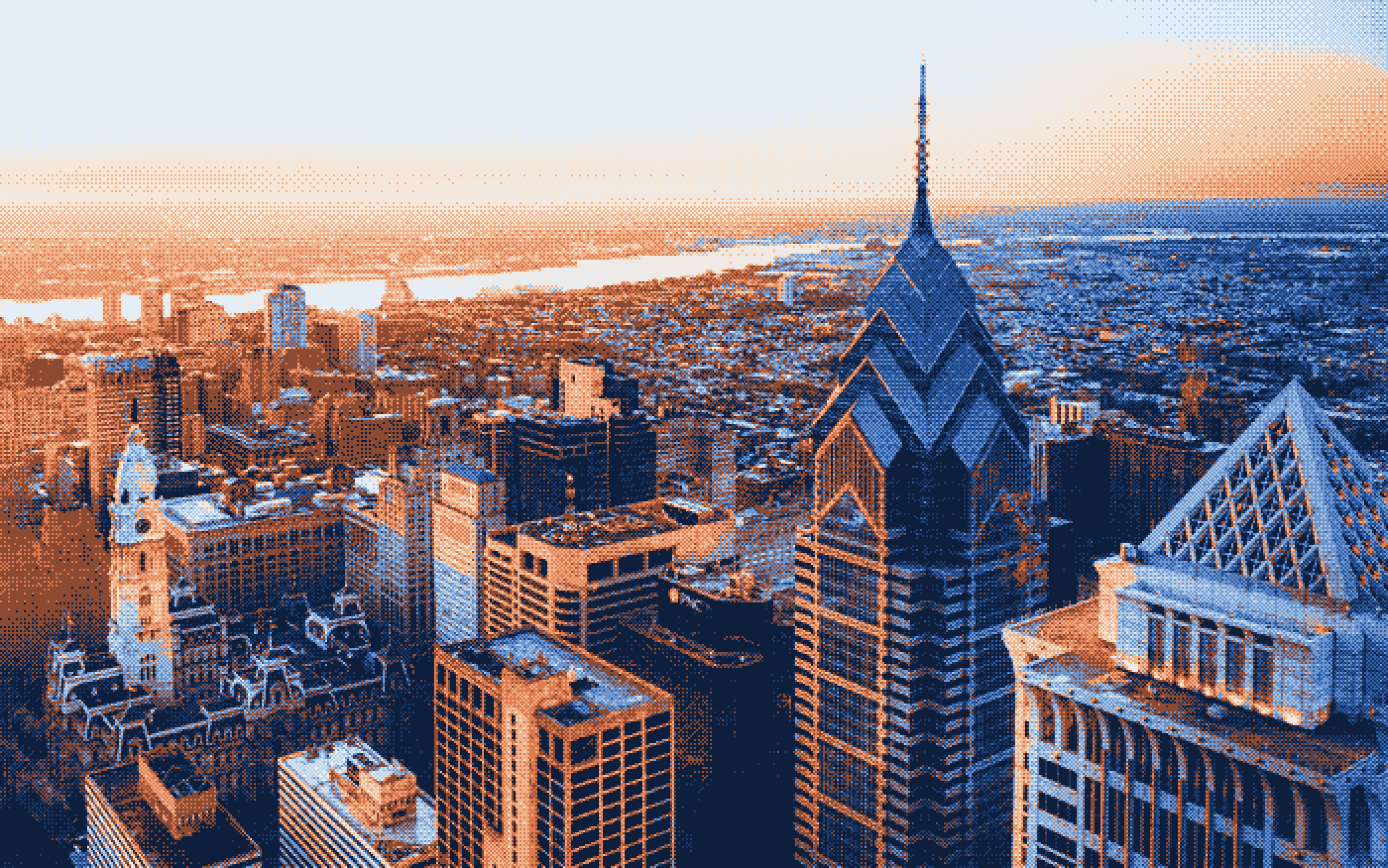 A wide Philadelphia river and skyline view in soft evening light